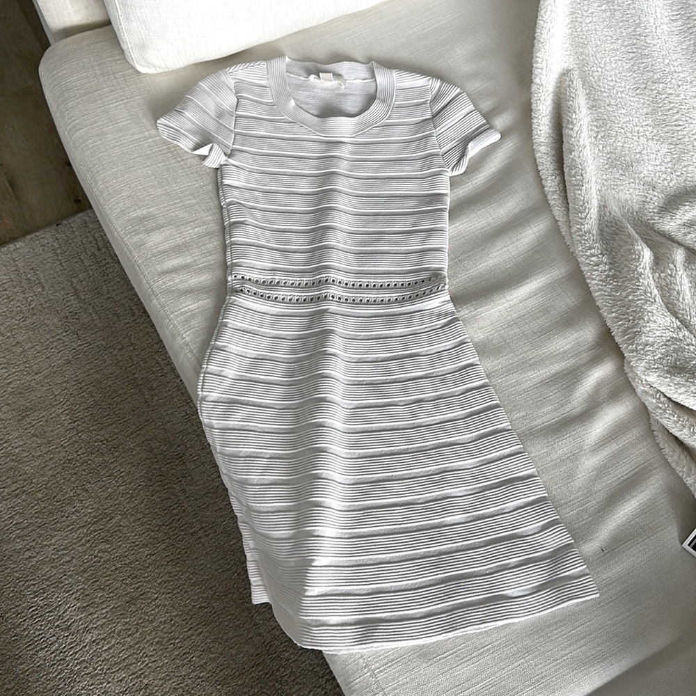 Michael Kors form fitting dress with smell cut out mid drift